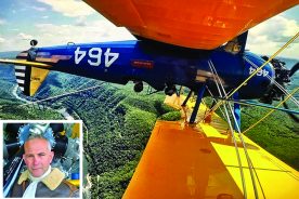 Chris Kappler (inset) does a loop-de-loop over West Virginia’s New River Gorge for a Wild Blue Adventure customer in his restored 1943 Boeing Stearman. With each aerial tour, pilot Chris Kappler is transformed into a World War II flying ace.
