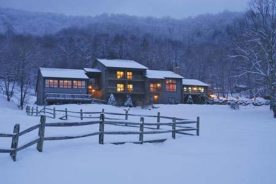The Inn at Yonahlossee glows in winter snow. The 300-acre North Carolina getaway began as a girls’ camp in the 1920s.