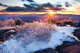 The last light of sunset illuminates a sparkling layer of rime ice on Spy Rock near Montebello on Virginia’s Appalachian Trail.