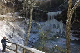 Gail at The Cascades, before the snow got deep enough to reveal . .. cat tracks!