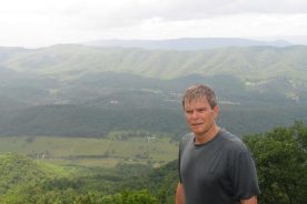 Looking out over the Catawba Valley from Tinker Cliffs, behind a man whose shirt got wet from sweat, see, not rain.