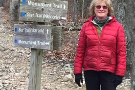 The Greatest Day Hiker Of Them All pauses at the intersection of the Star and Monument trails before heading on around the mountain toward breakfast.