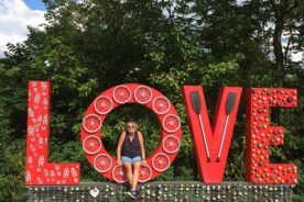 The Greatest Day H(b)iker  Of Them All pauses at the Lynchburg LOVEworks sign along the Riverwalk.