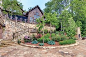 Gardens are terraced behind the Dodson home to open up unobstructed views of western North Carolina’s Lake Toxaway.